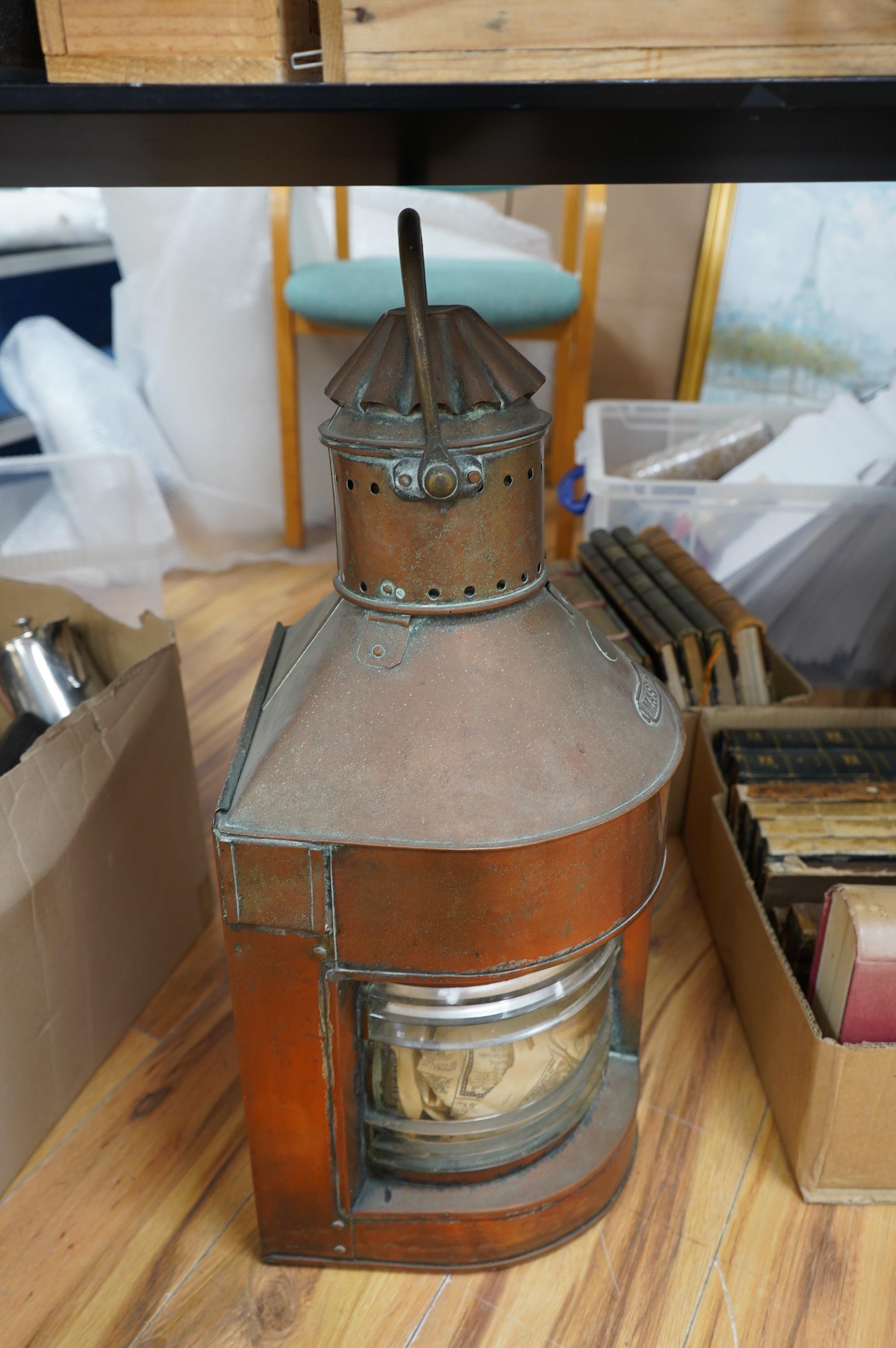 An early 20th century ship’s copper mast head lamp, 69cm high. Condition - fair